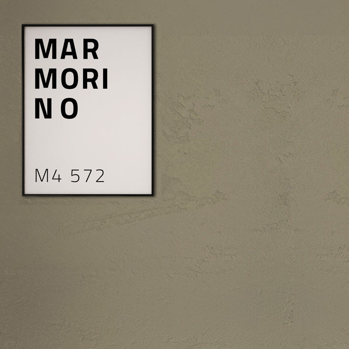 Wooden dresser against a beige wall with a framed text art piece above it.